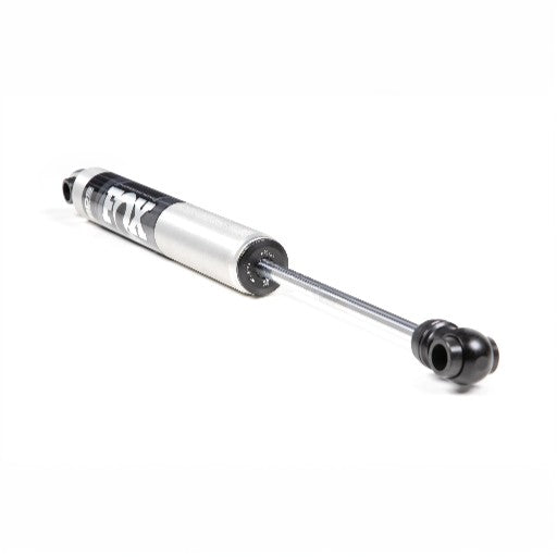 The FOX ST103 2.0 IFP Steering Stabilizer for Ford F250/F350 features a silver and black 6061-T6 aluminum mono-tube body and high-flow piston, designed to enhance vehicle suspension, shown against a white background.