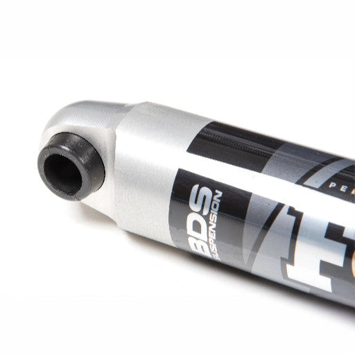 Close-up of a FOX 2.0 IFP Steering Stabilizer (ST103) for Ford F250/F350, featuring durable 6061-T6 aluminum construction with FOX branding, showing one mounting end and part of the logo.